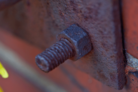 Rusty nut on a threaded rod.