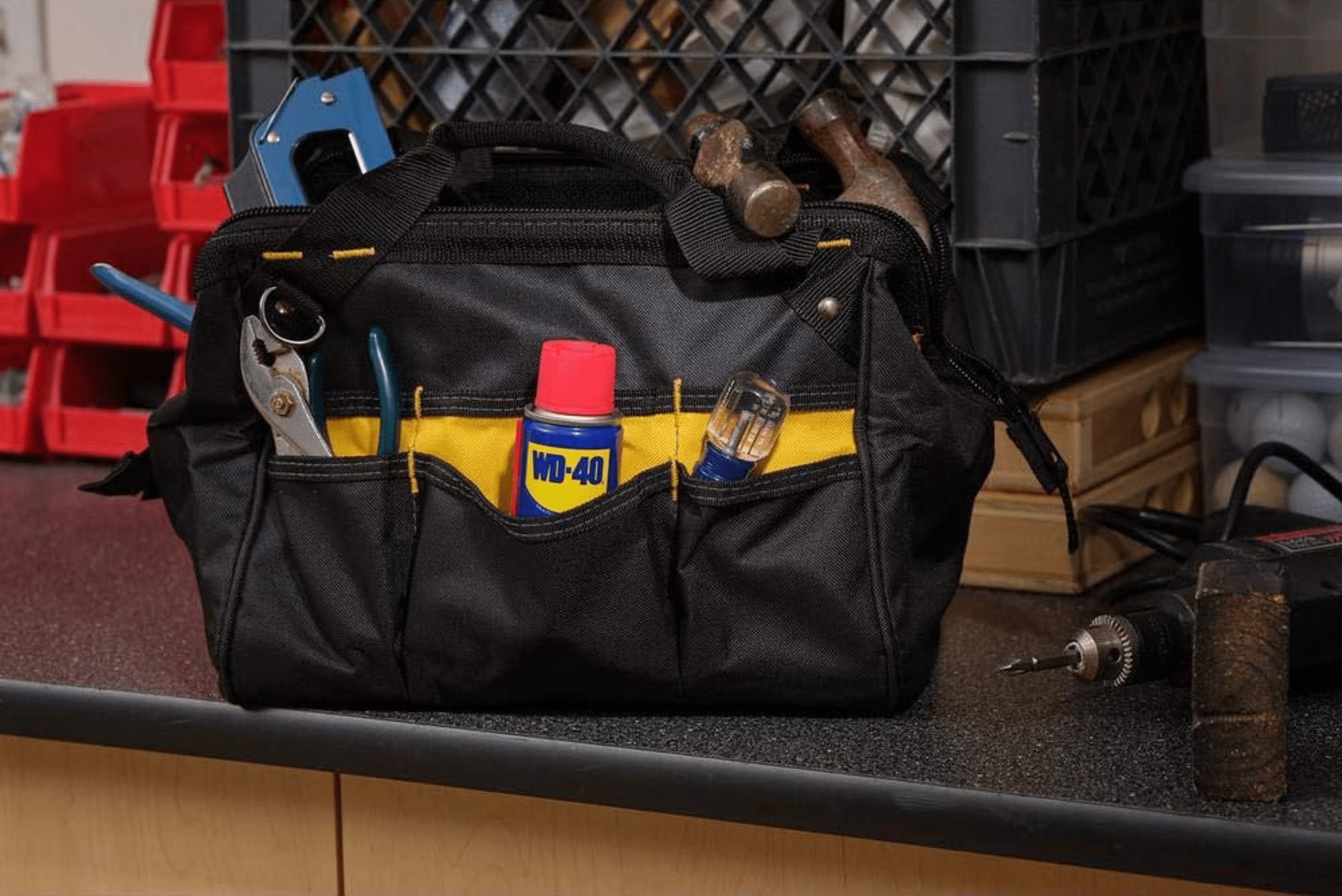 A tool bag with WD-40 spray in one of the pockets.