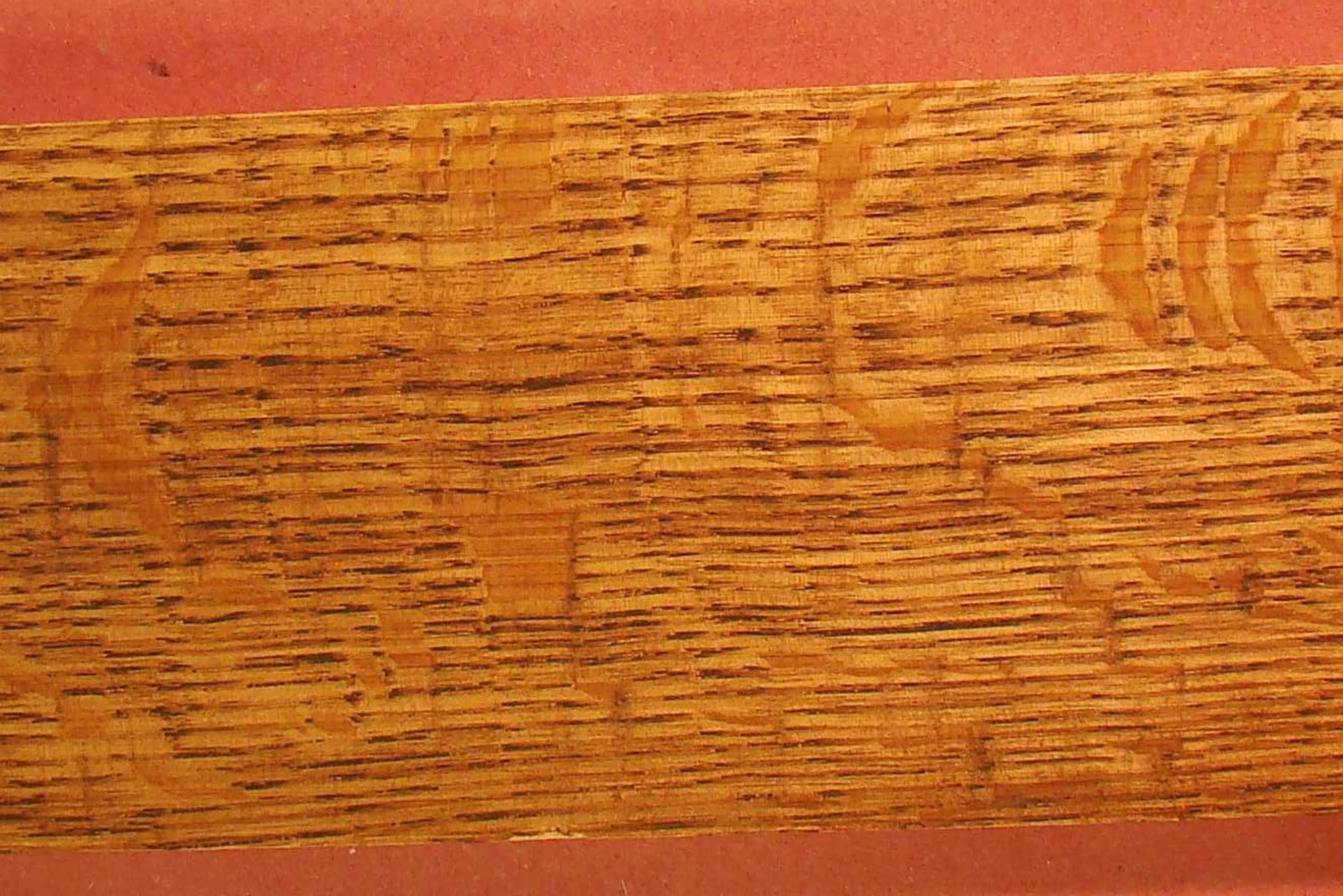 Quarter sawn wood face with grain.