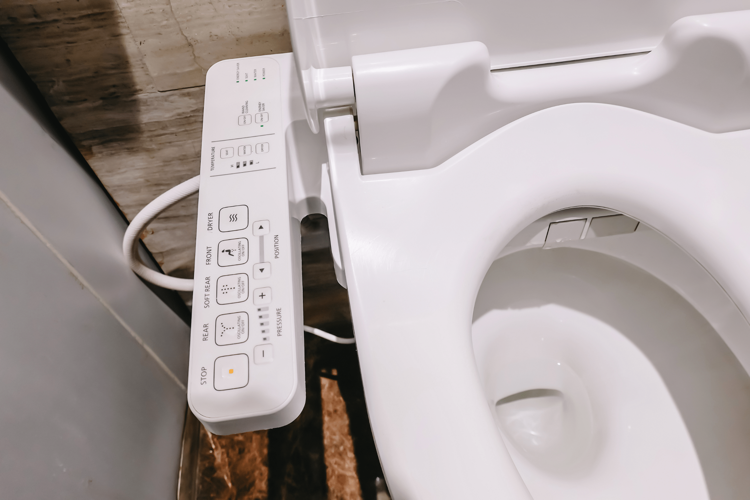 Modern bidet with controls within the toilet seat.