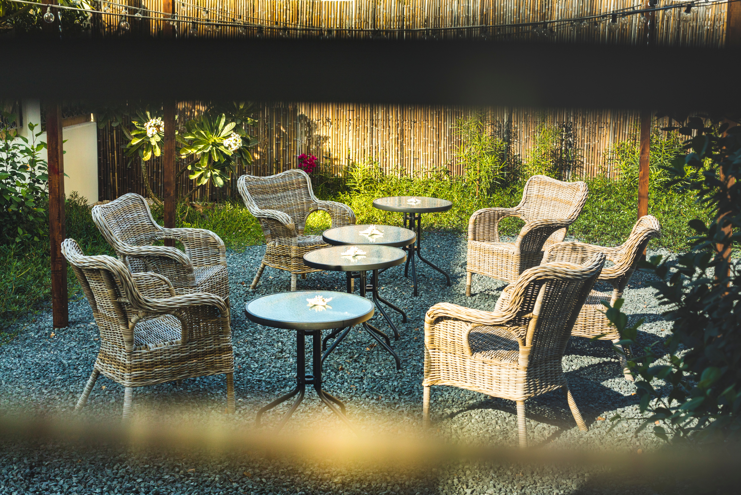 A patio set with gravel ground.