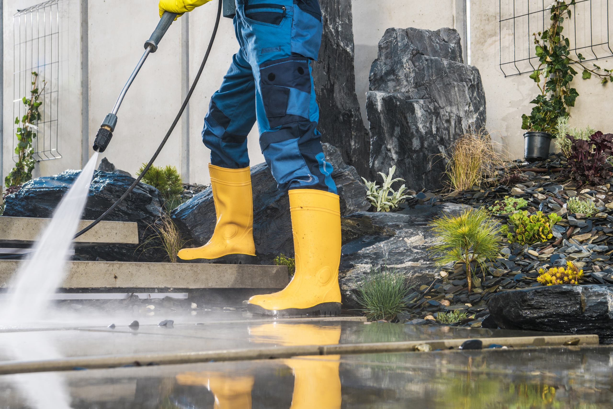 Person cleaning rust stains from concrete.