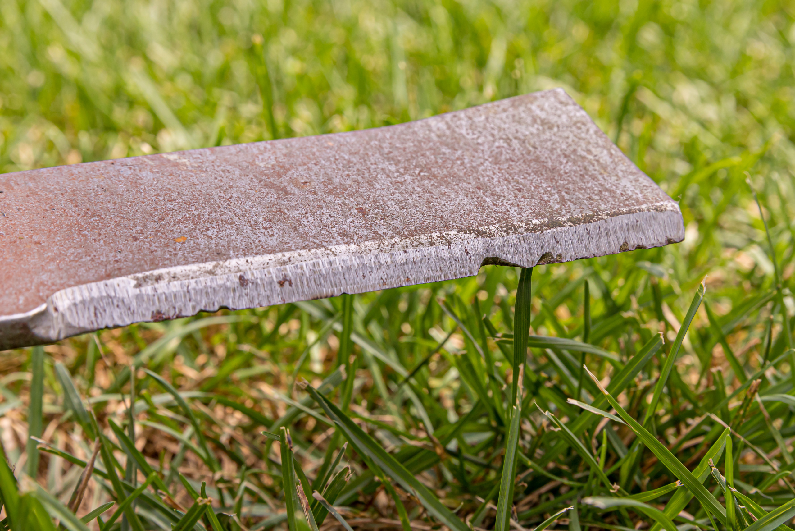 Dull lawn mower blade.