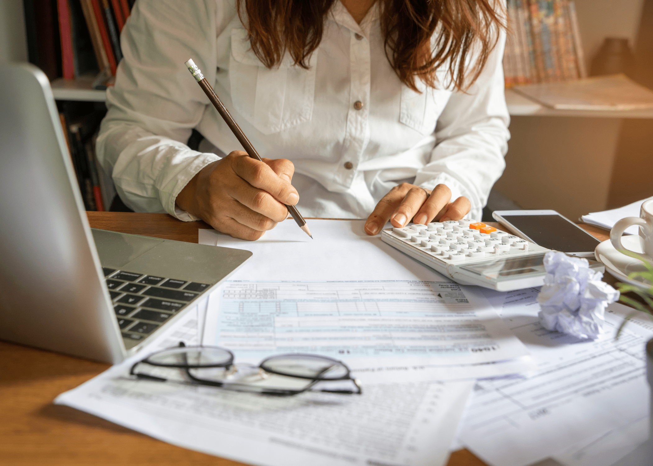 woman working at a desk on a budget