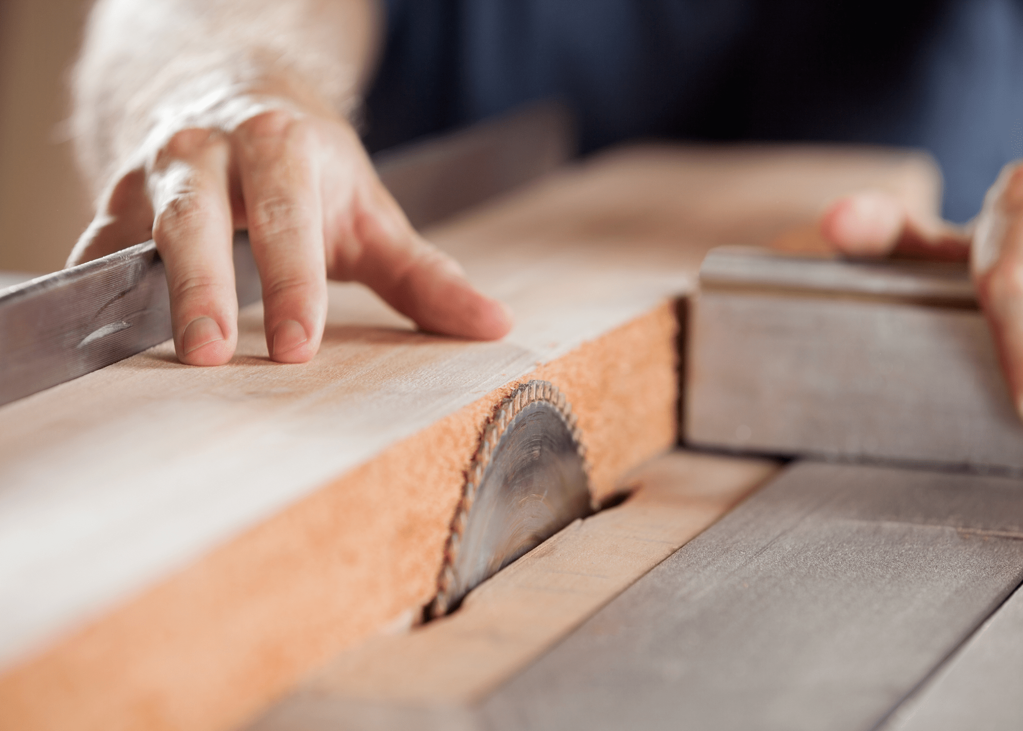 close up of cutting wood with a table saw