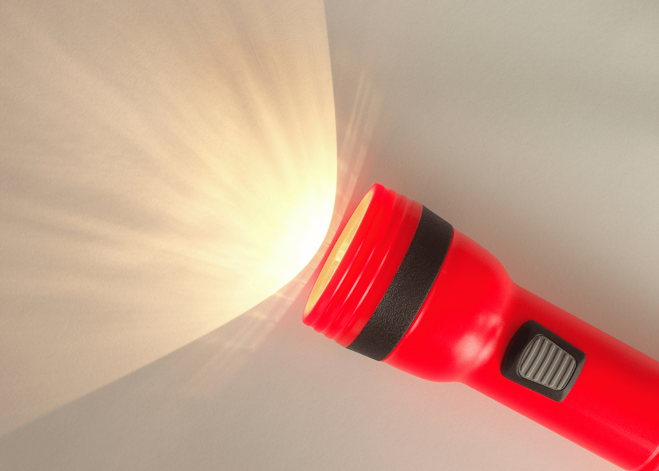 red flashlight on white background