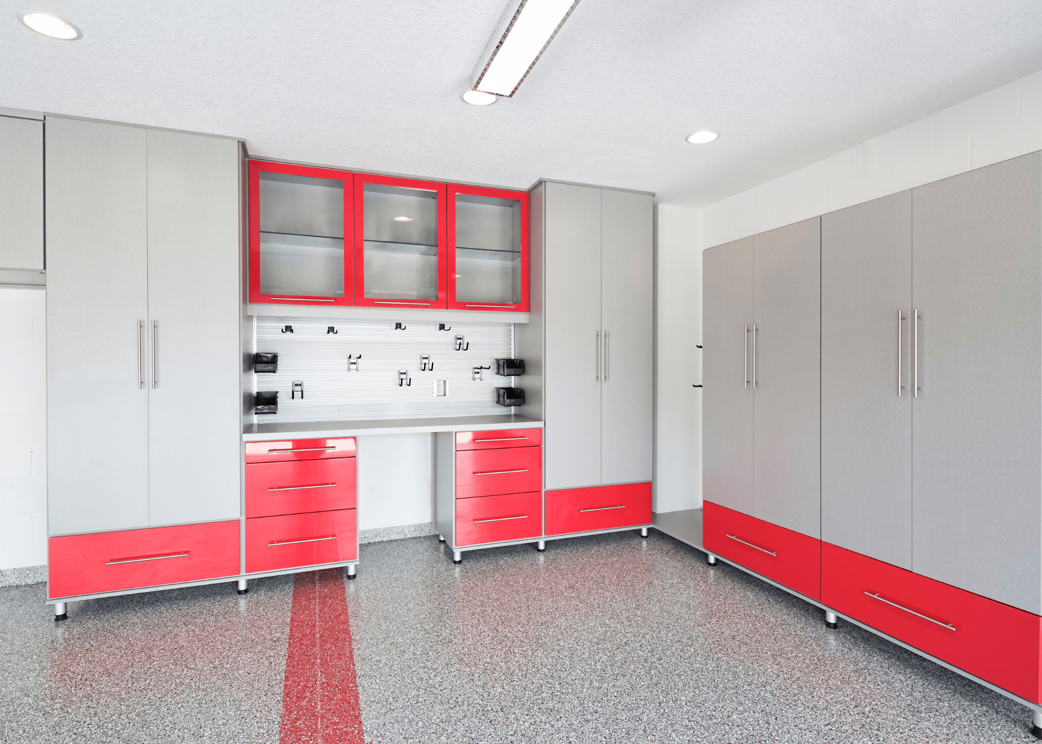 clean garage with red and grey tool storage boxes