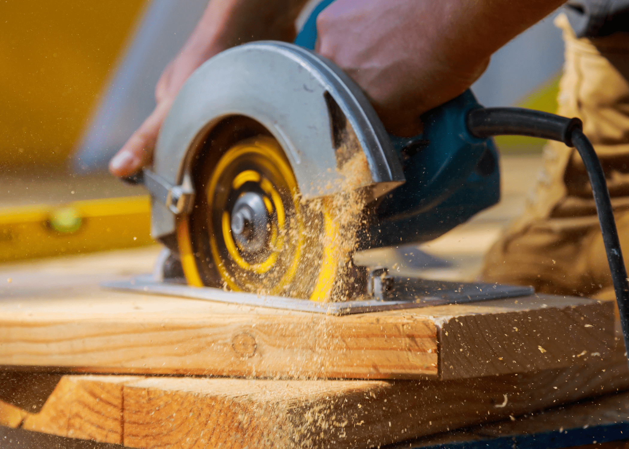 circular saw in motion cutting through wood