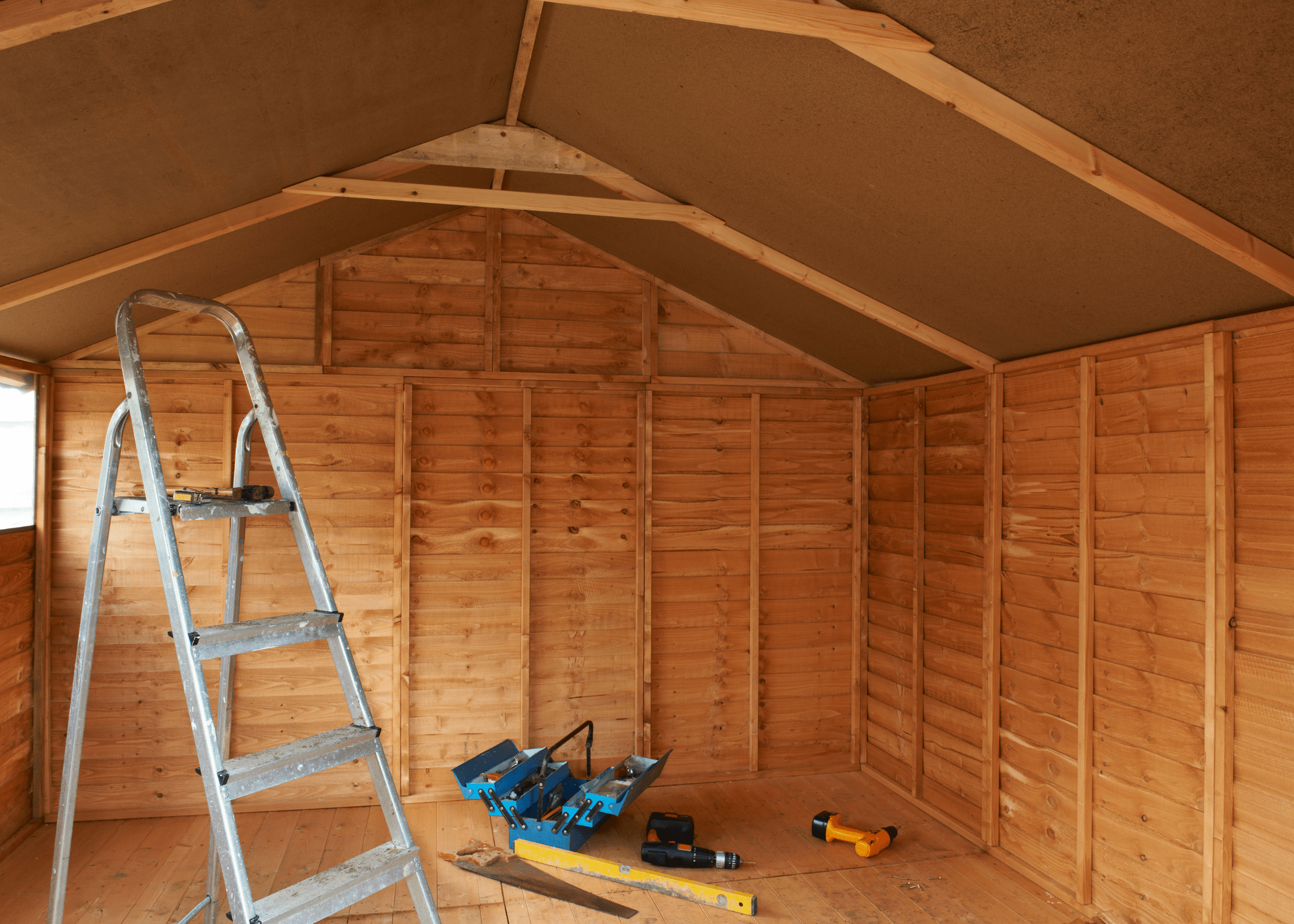 empty shed with ladder and toolbox