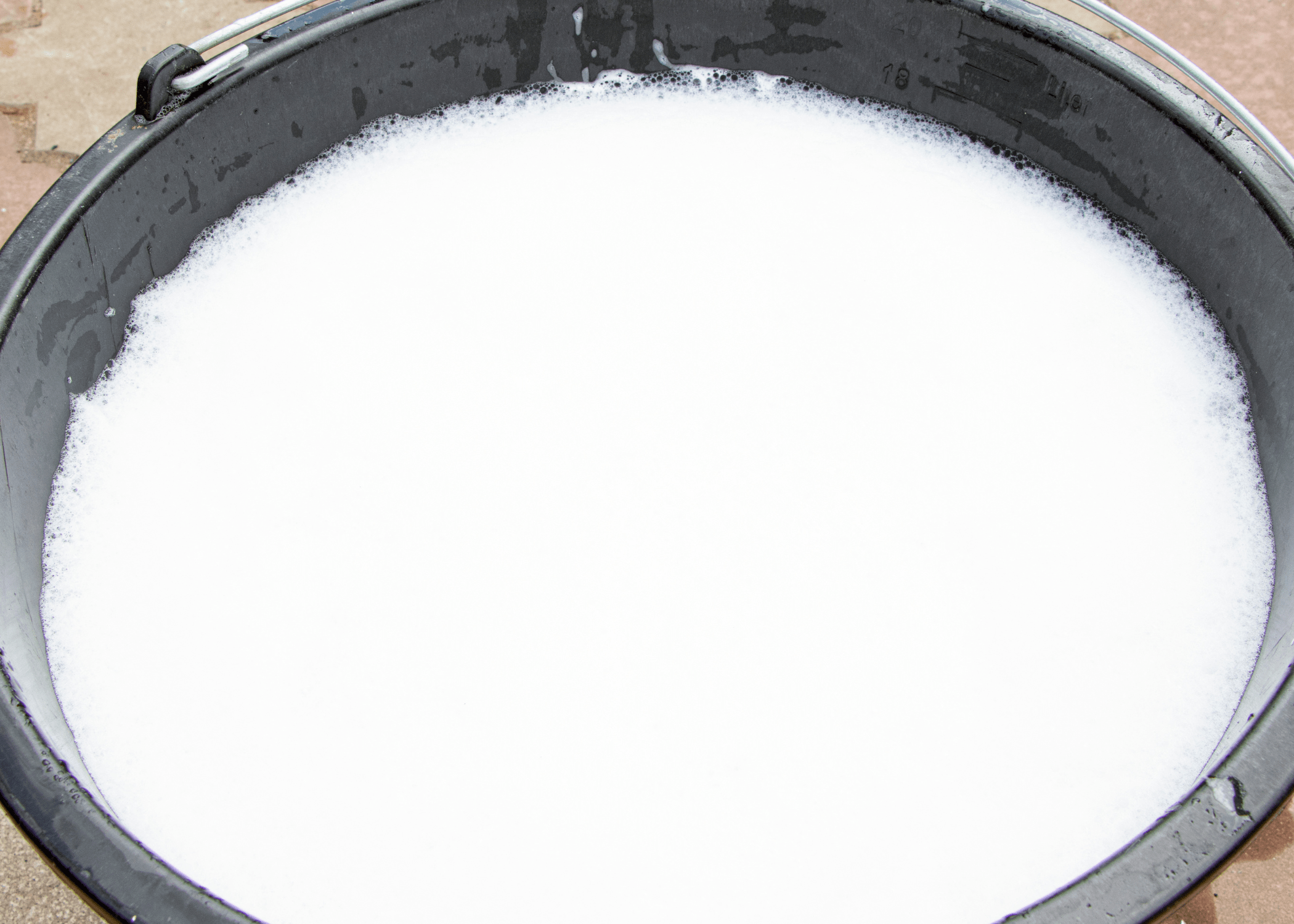 close up of a bucket of soapy water