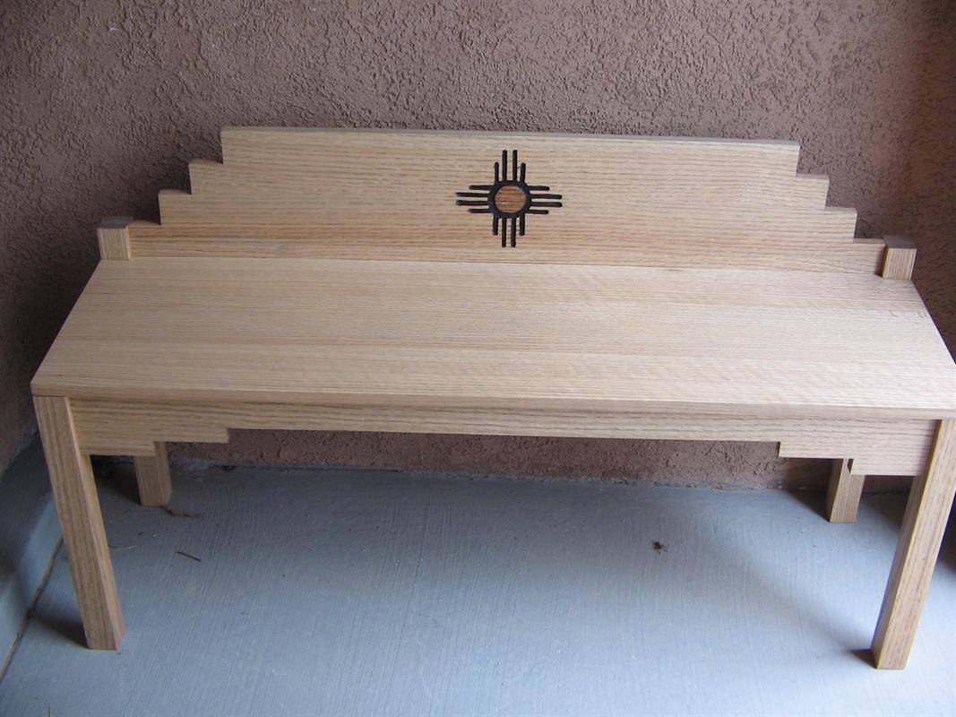 A southwestern style bench made from wood.
