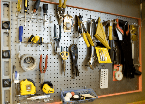 peg board filled with tools