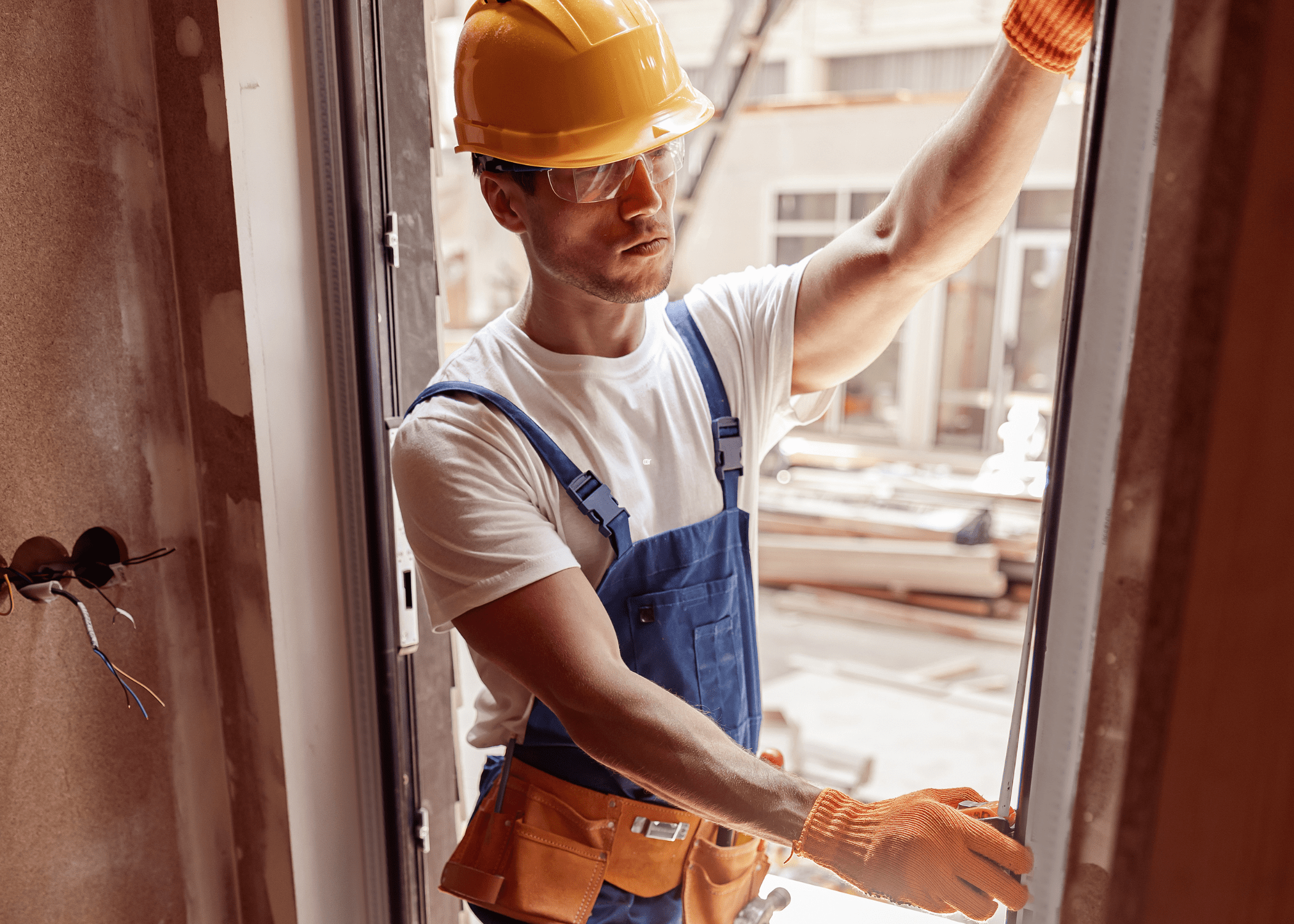 man measuring door frame