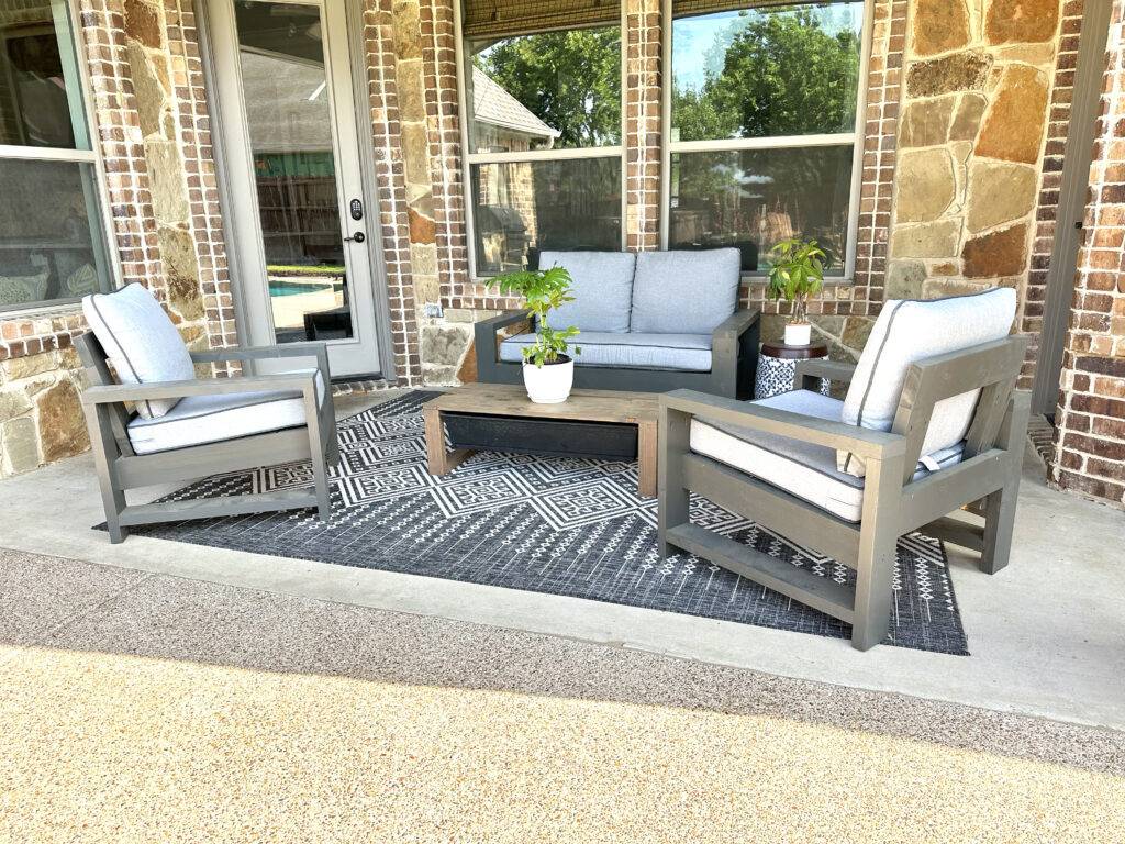 DIY outdoor patio set made of wood and has stained finish.