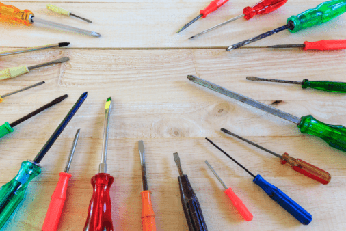 A bunch of screwdrivers on wood.