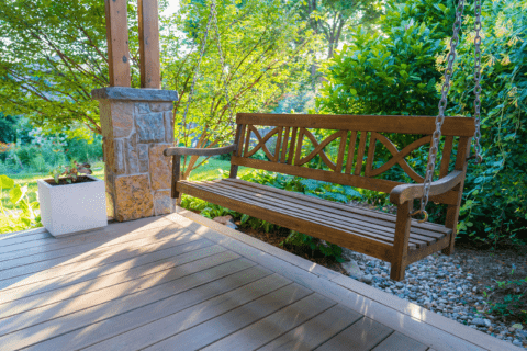 A wooden patio swing.