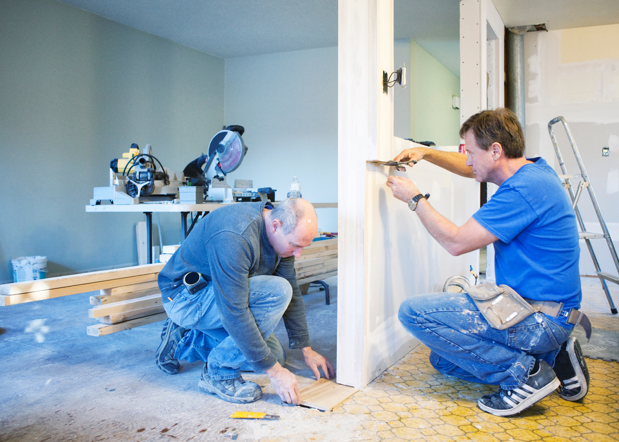 two men working on an house renovation