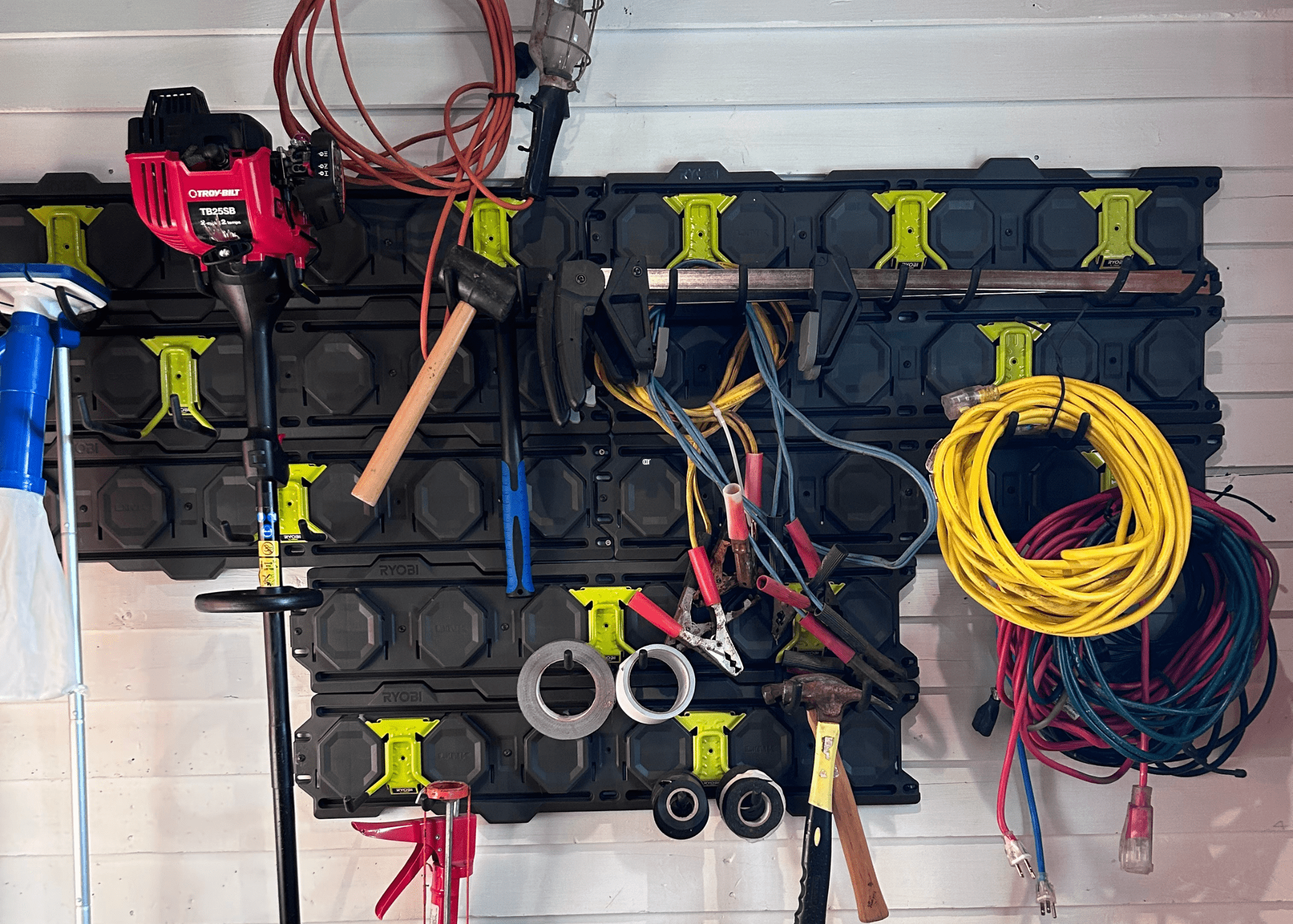 hanging ryobi wall system with tools on it