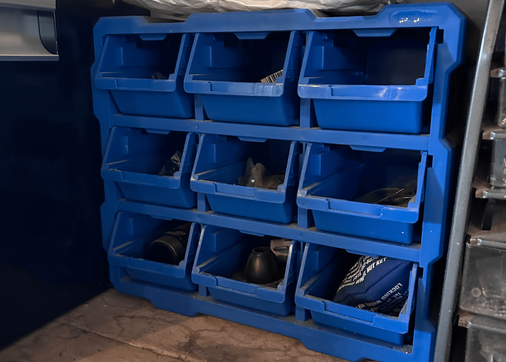 blue storage boxes on workbench