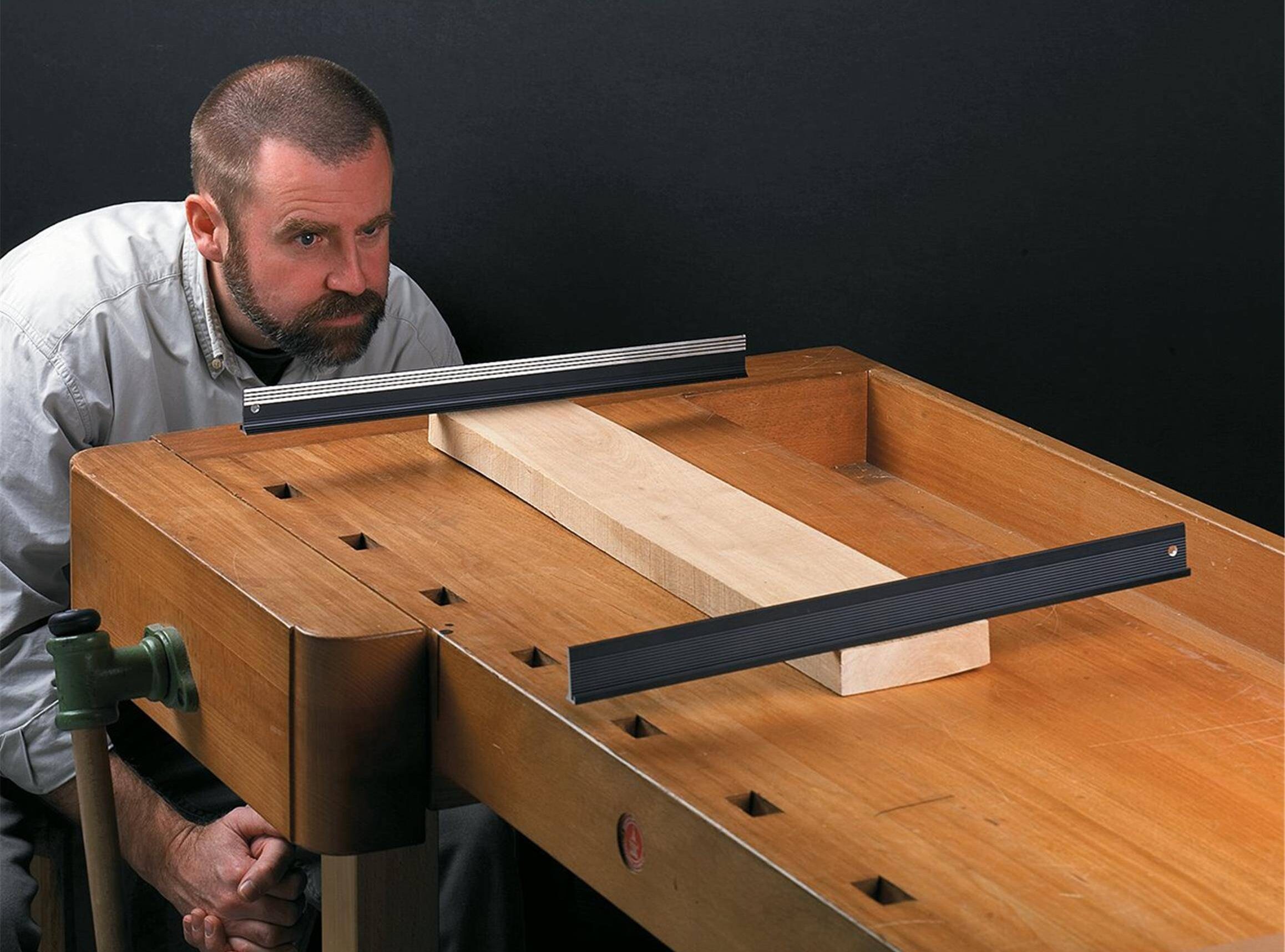 man looking at winding sticks