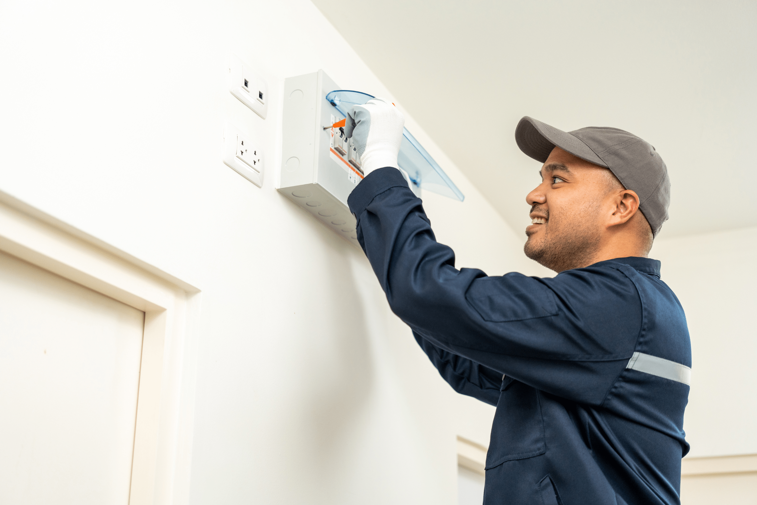 Man inspect a home's electrical system.