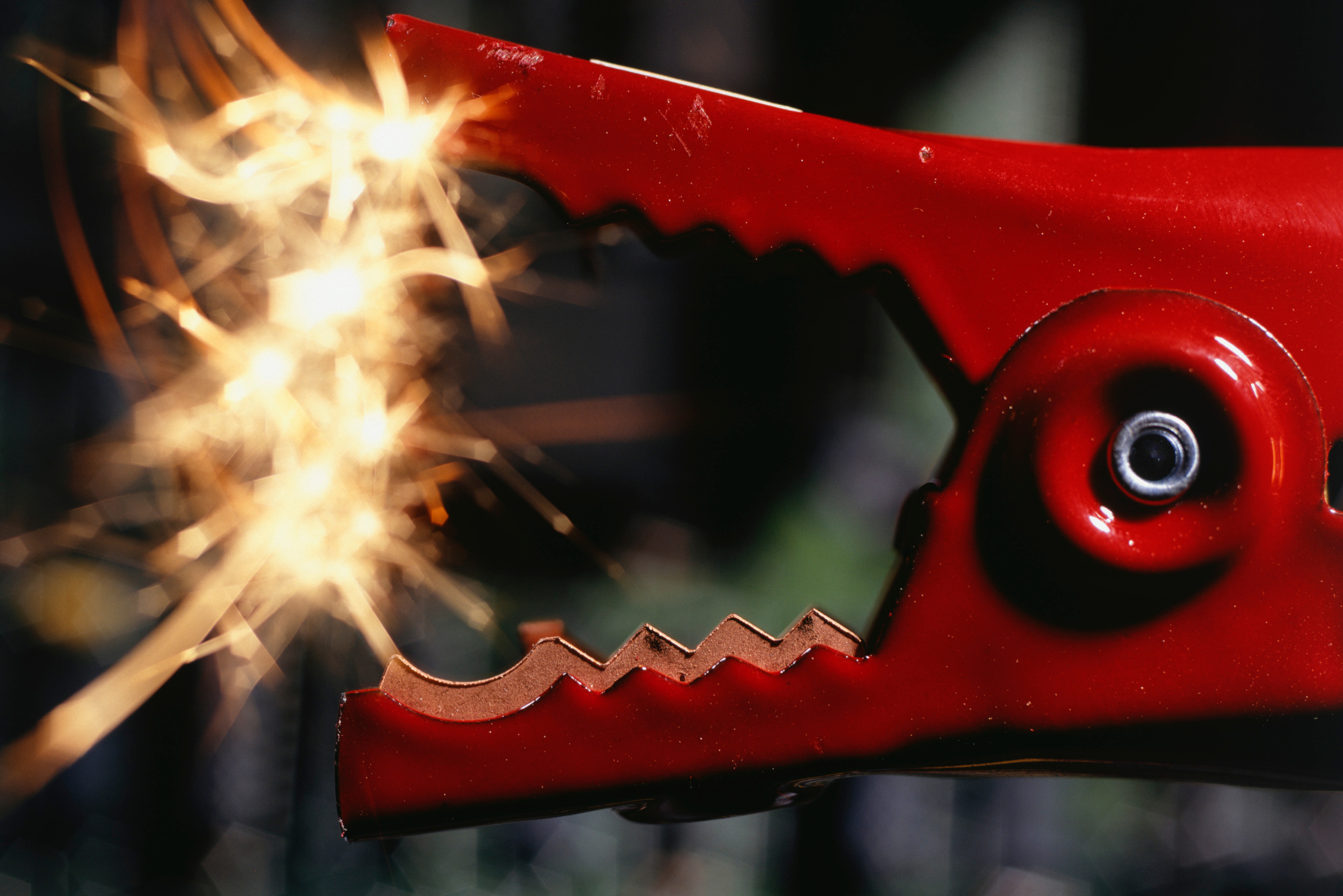 Sparking car jumper red lead.