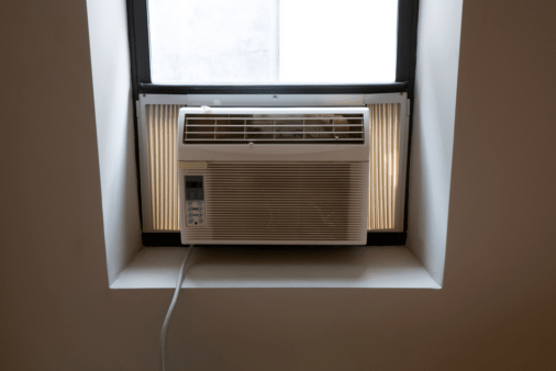 A/C window unit from the inside of a home.