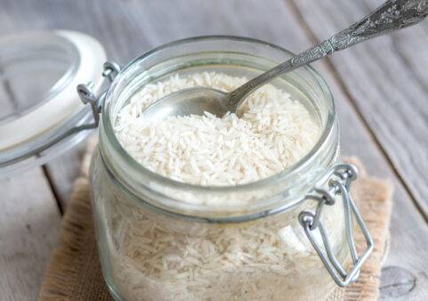 Basmati rice in a glass jar with a spoon
