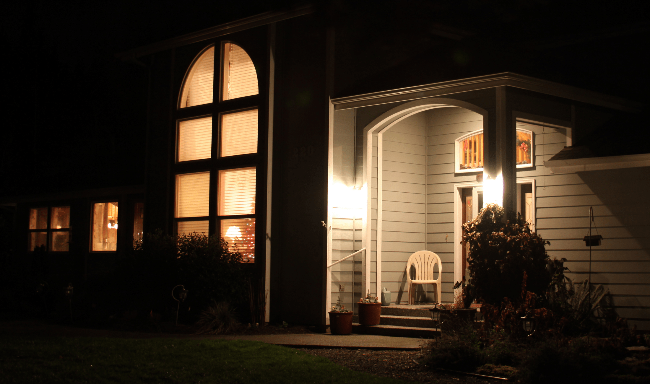 A dark porch with very bright porch lights.