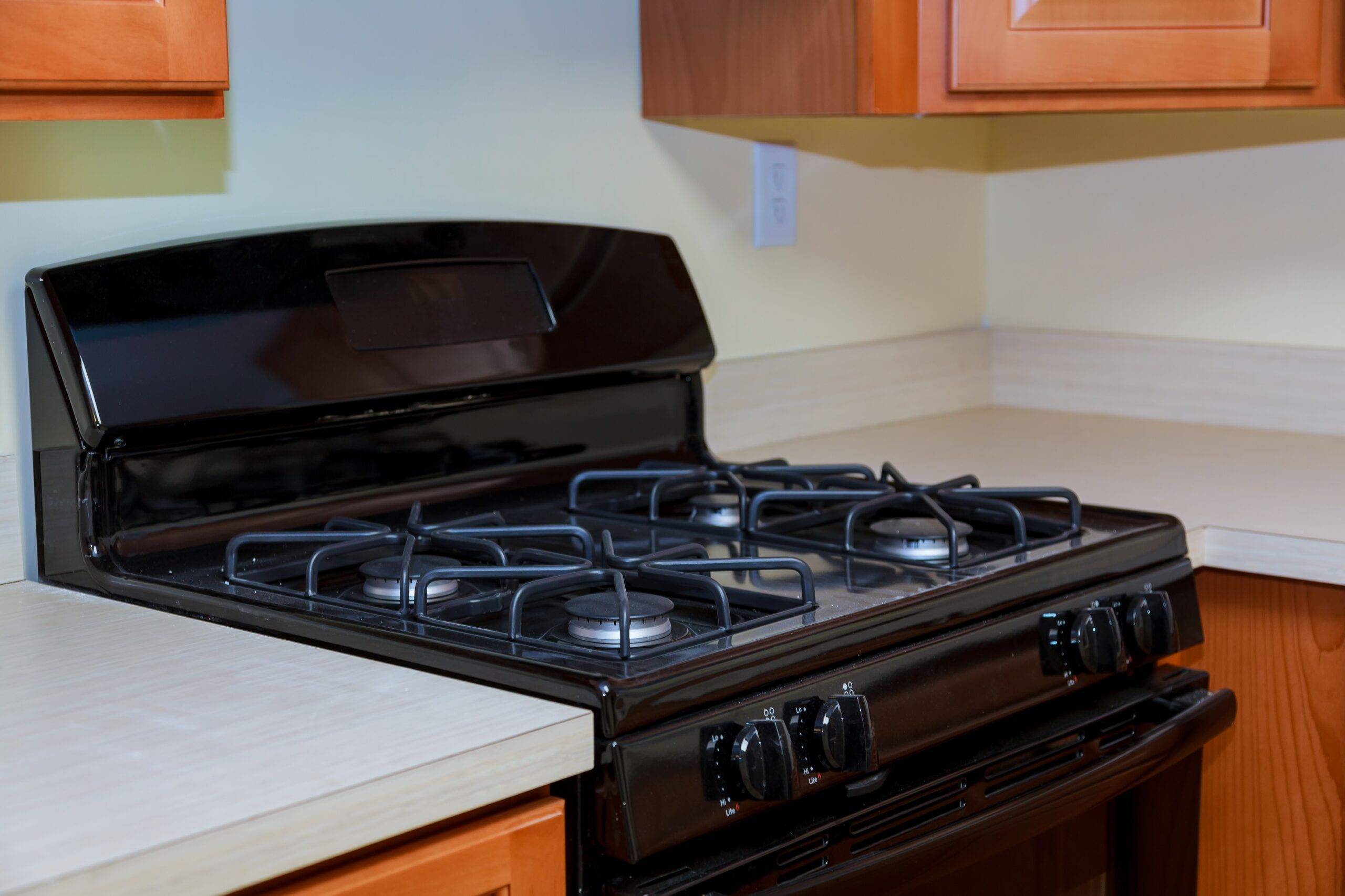 Close up image of the gas stove steal standing on kitchen gas stove.