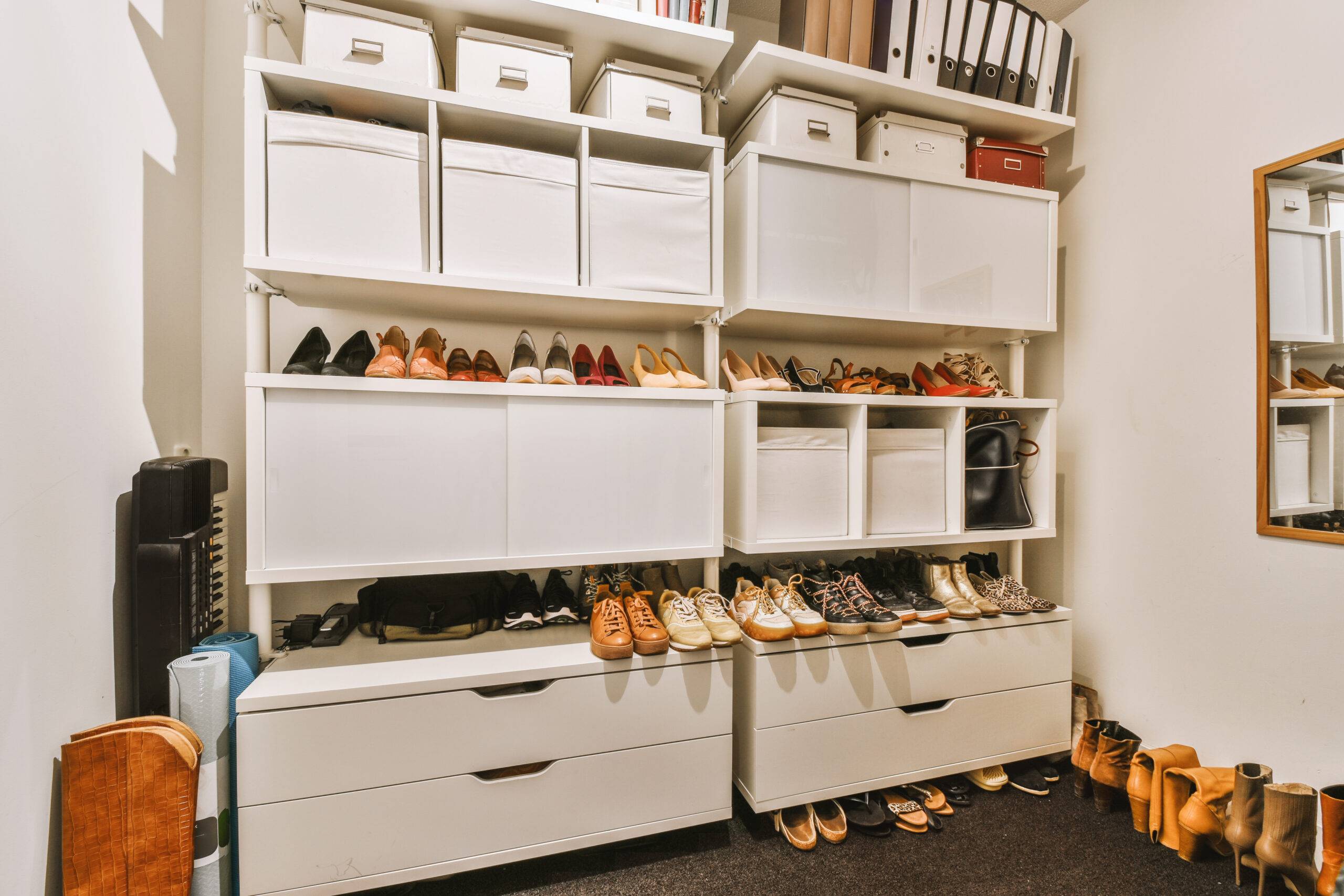 White wardrobe with mirrors located in light room at home