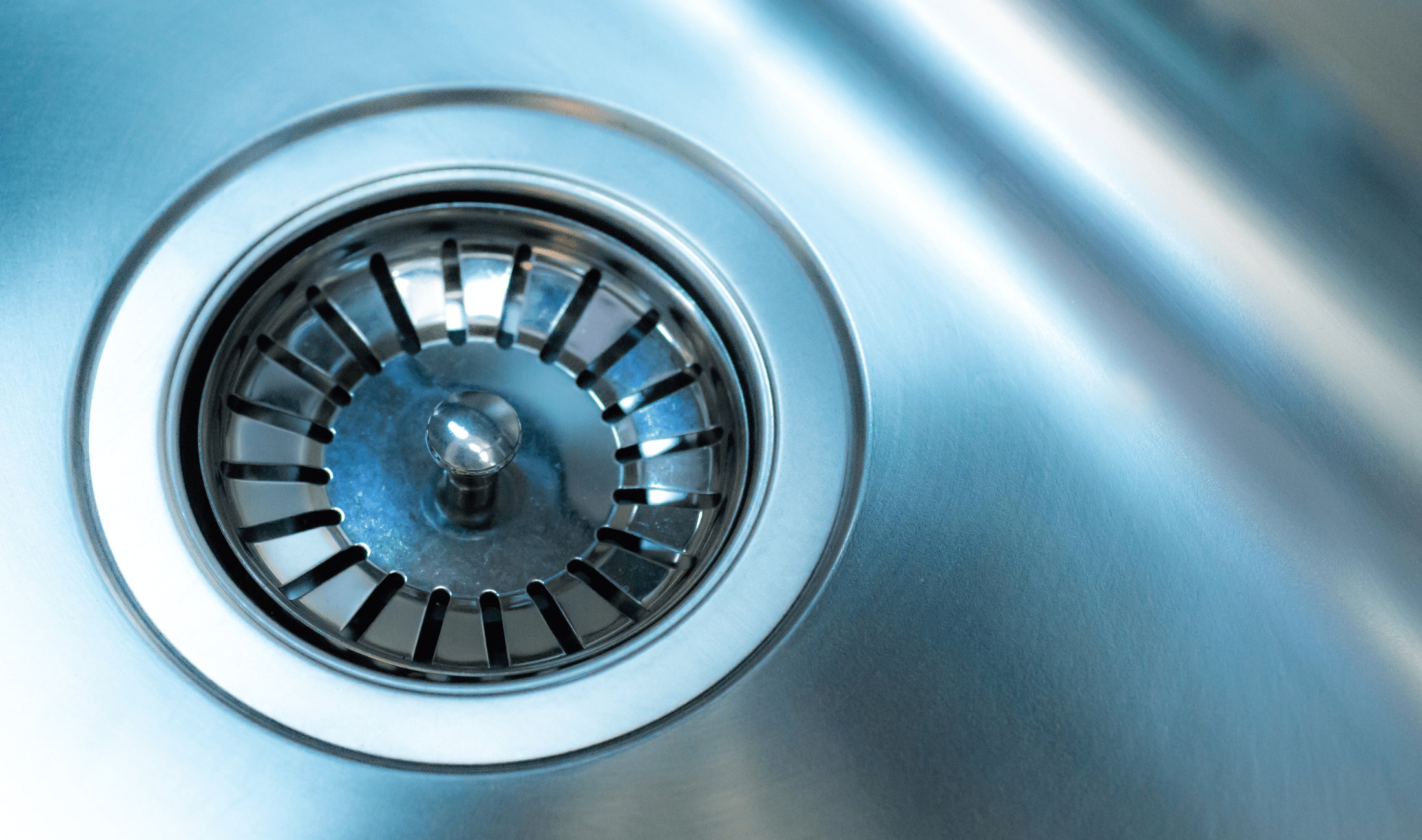A closeup sink drain.