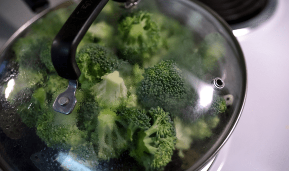 A pot of steamed broccoli.