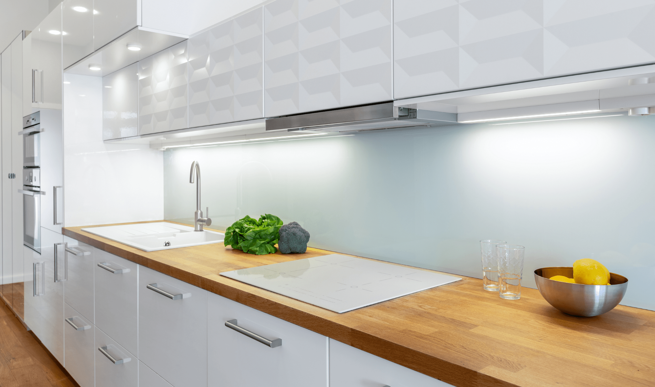 A kitchen counter with under-counter lighting.