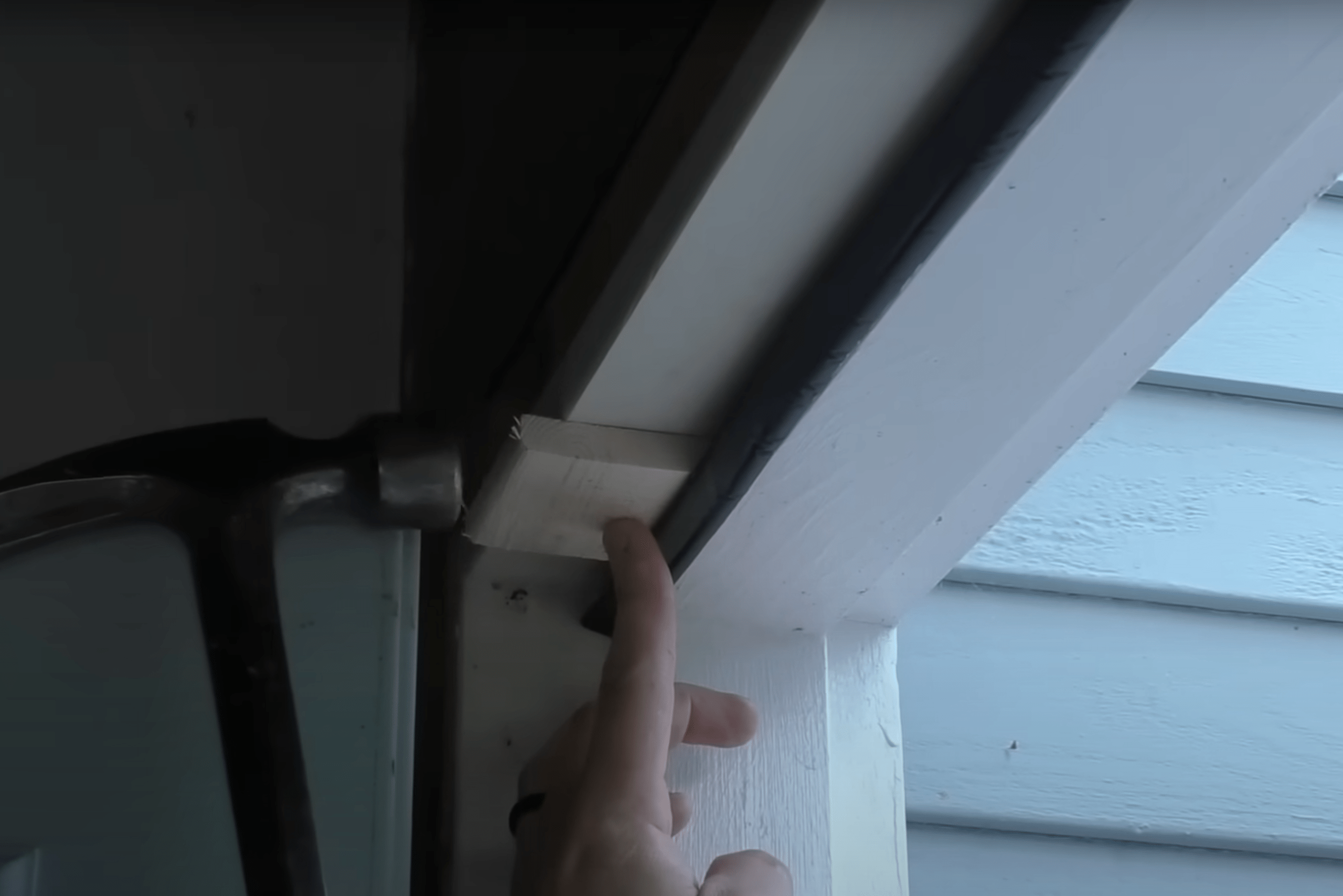 Using wood piece to push seal in all the way.