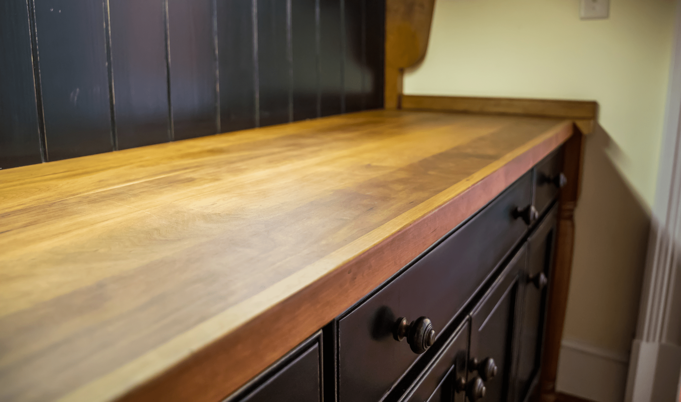 A close photo of a butcher block countertop.