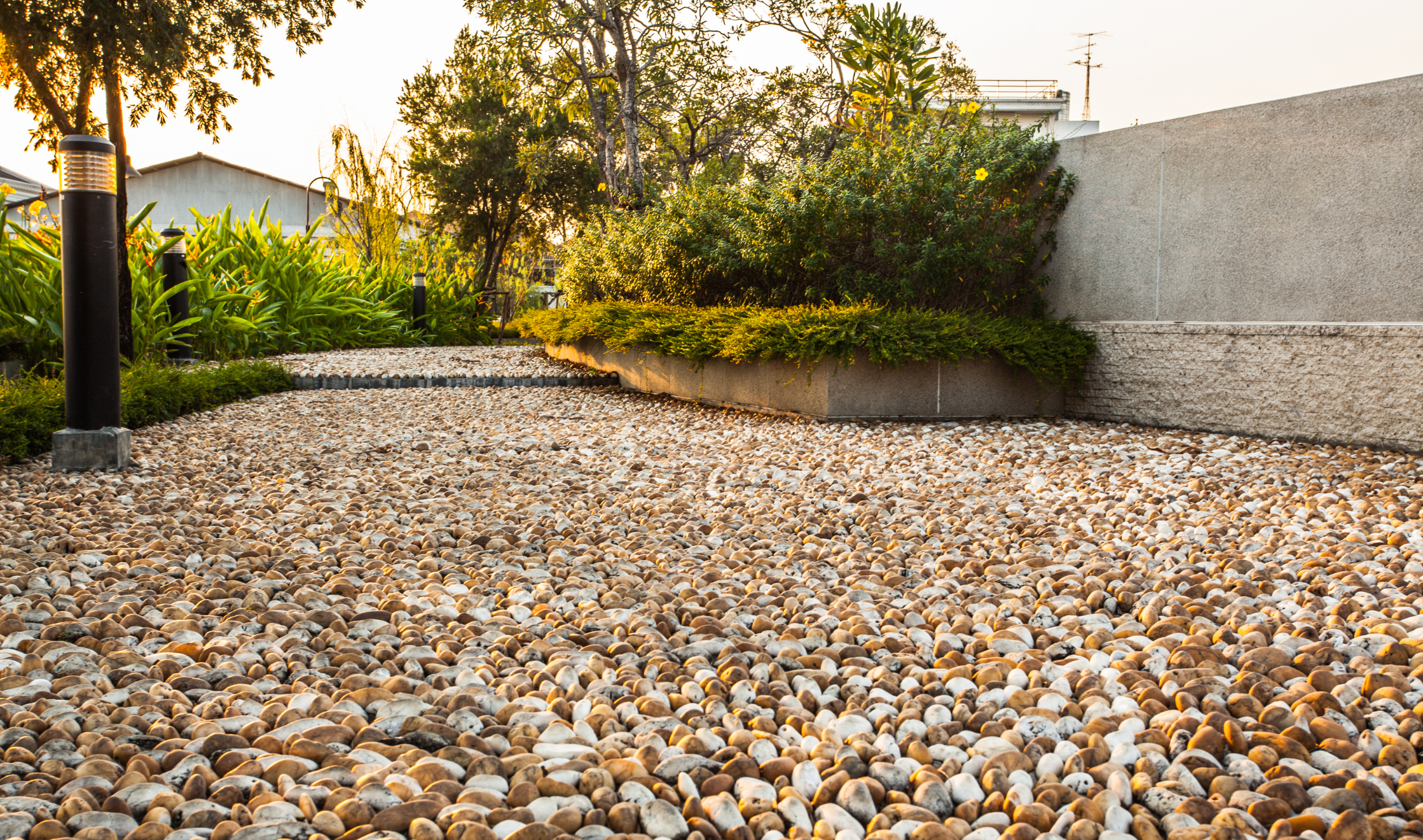 A home with a pebble lawn.