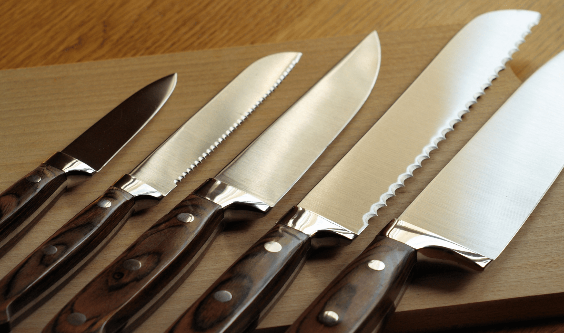 A lineup of professional chef's knives.