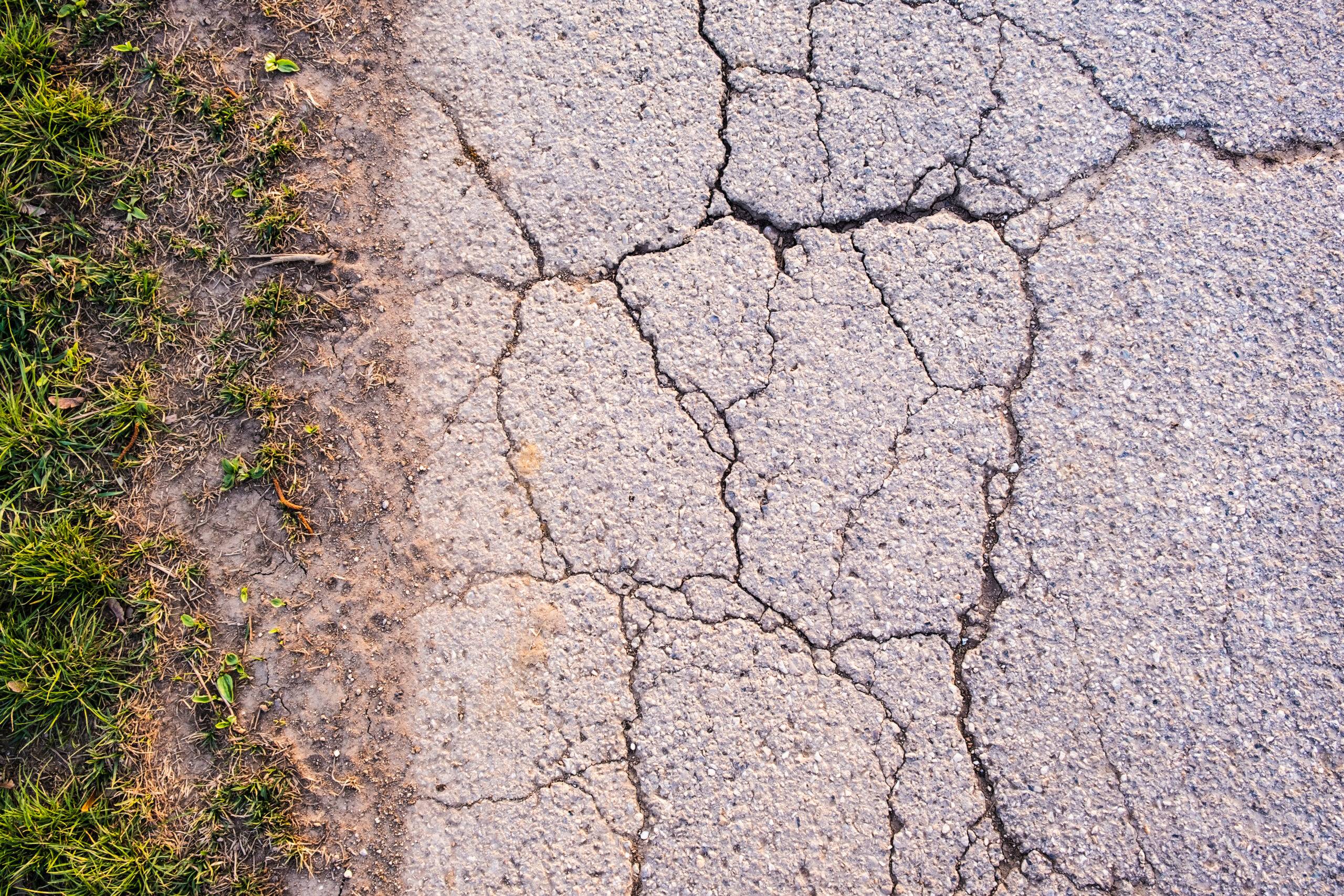 asphalt texture with cracks on rural road background