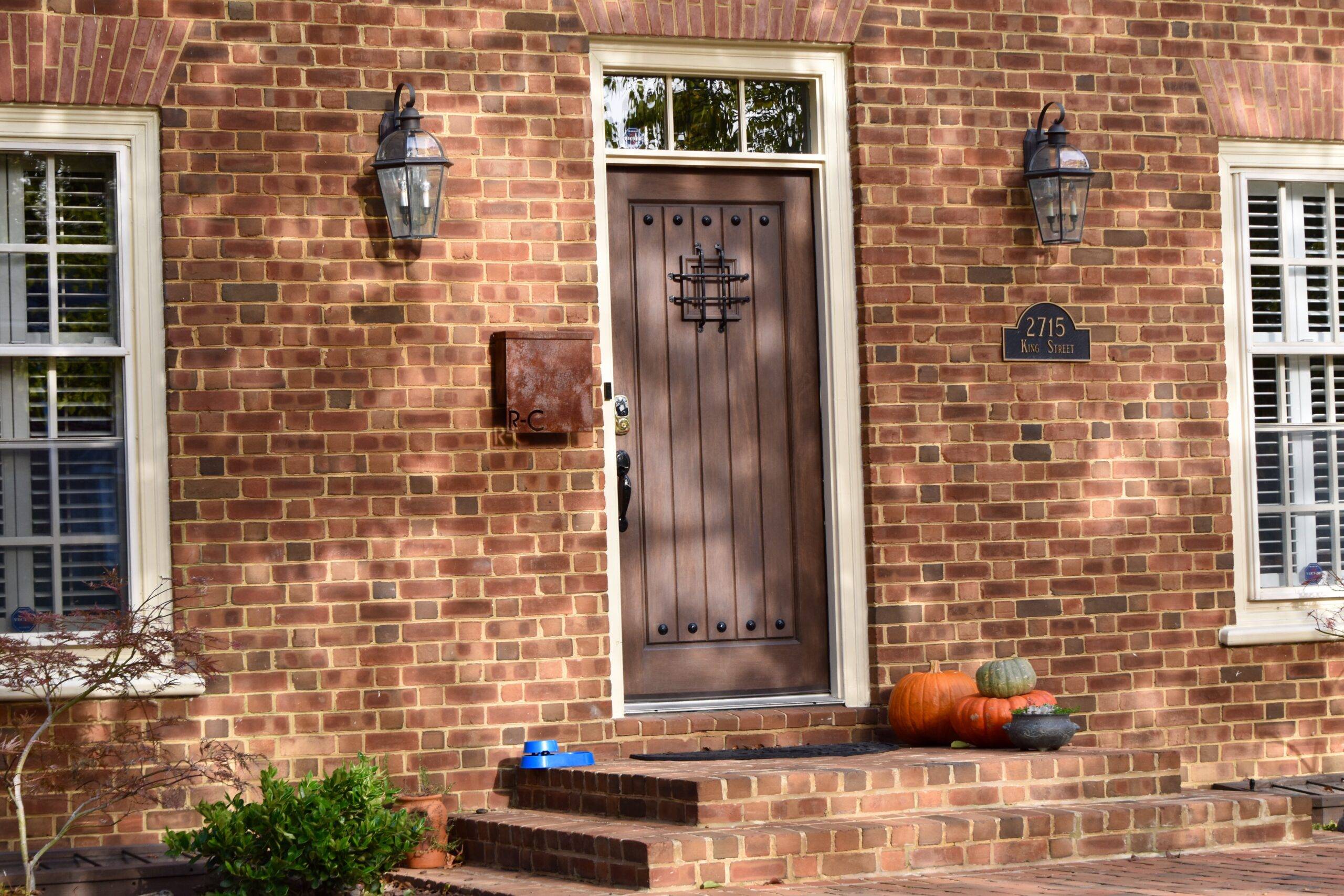 A home with an antiquated brown front door.