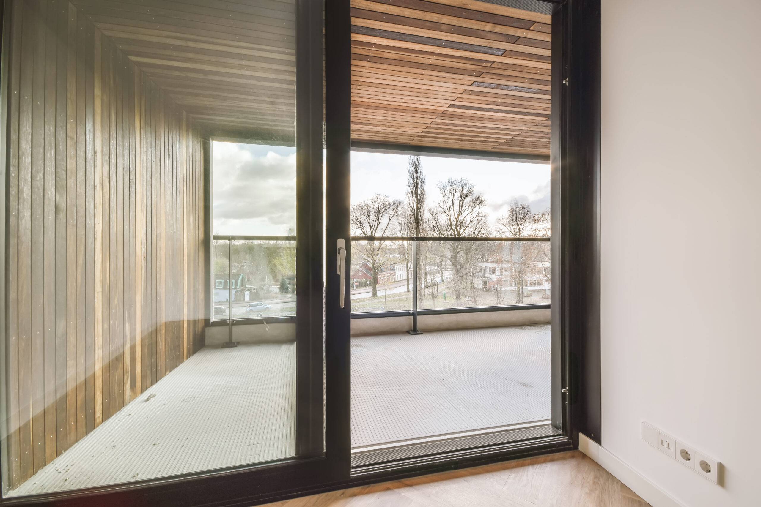 Delightful design of a room with a glass door leading to a balcony