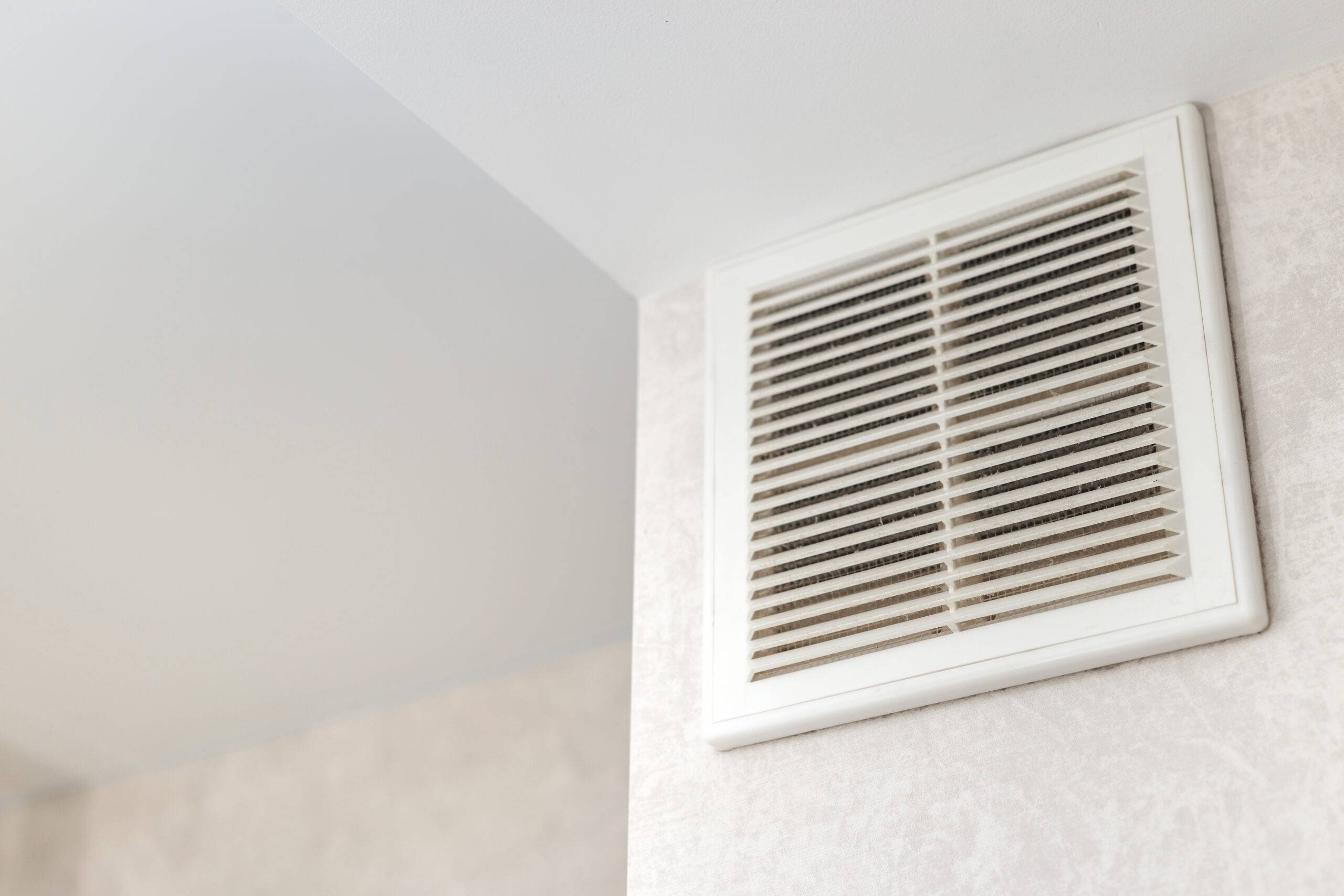 Dirty ventilation grille in the kitchen on the wall. Communication in the kitchen. Grease and dirt on the ventilation.