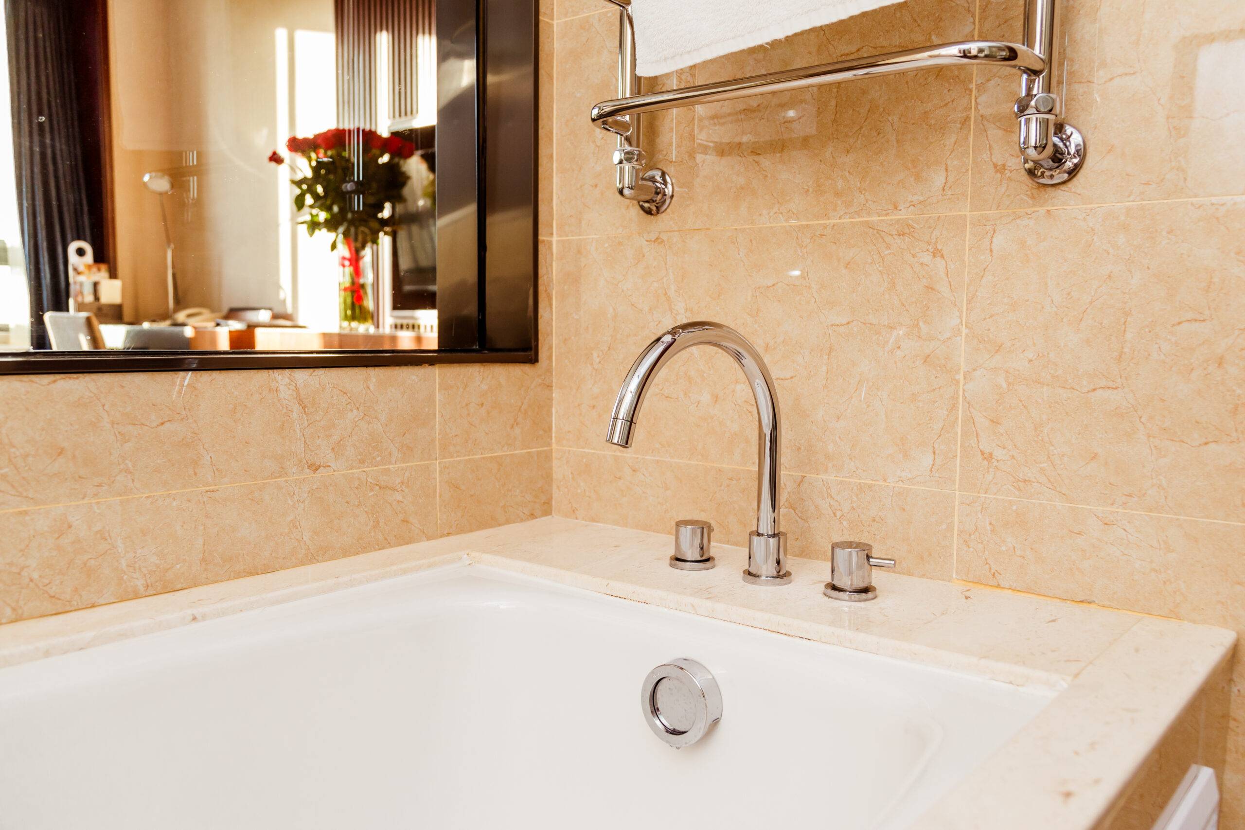 Luxury bath tub and faucet with water