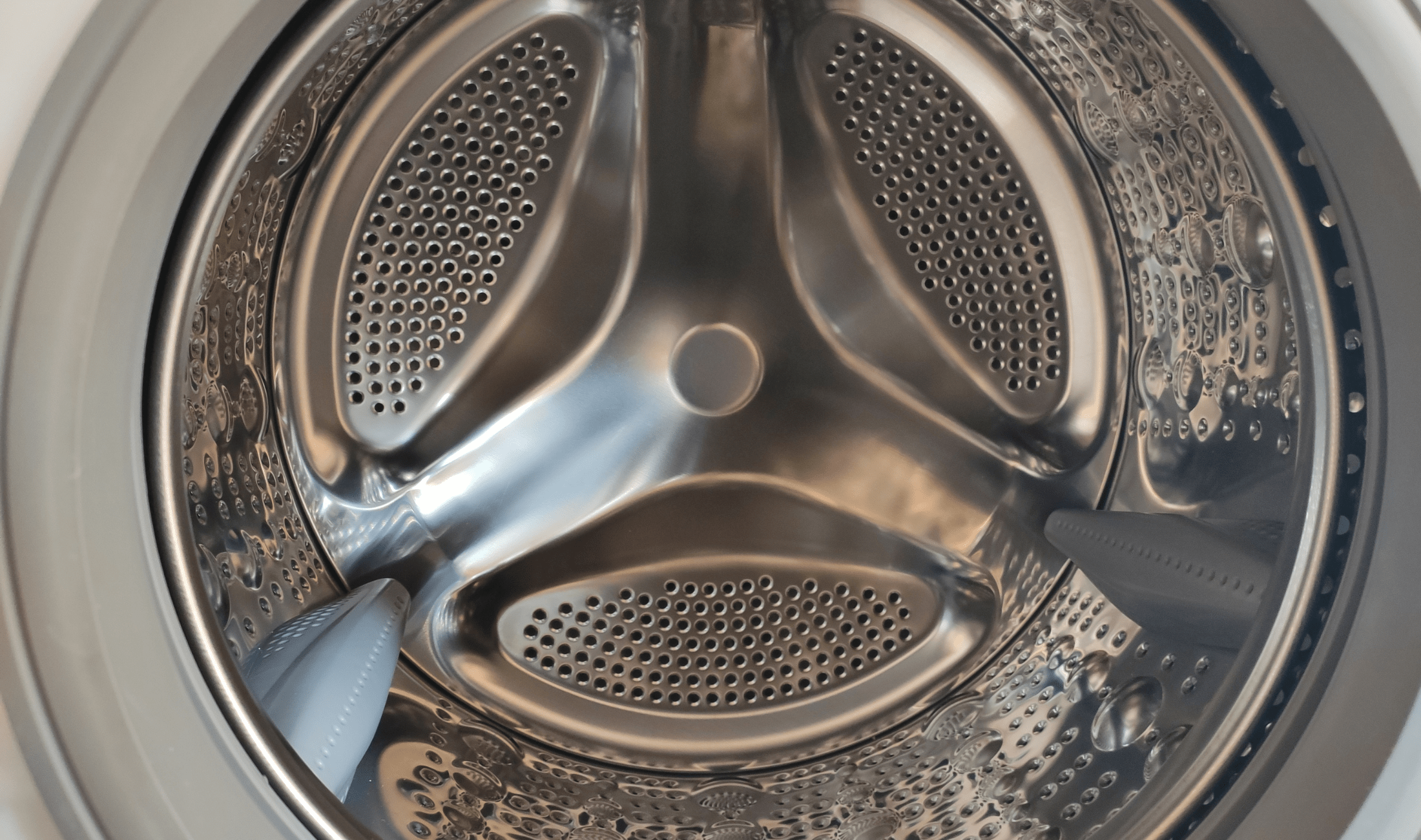 A close shot of a drum of a front-loading washing machine.