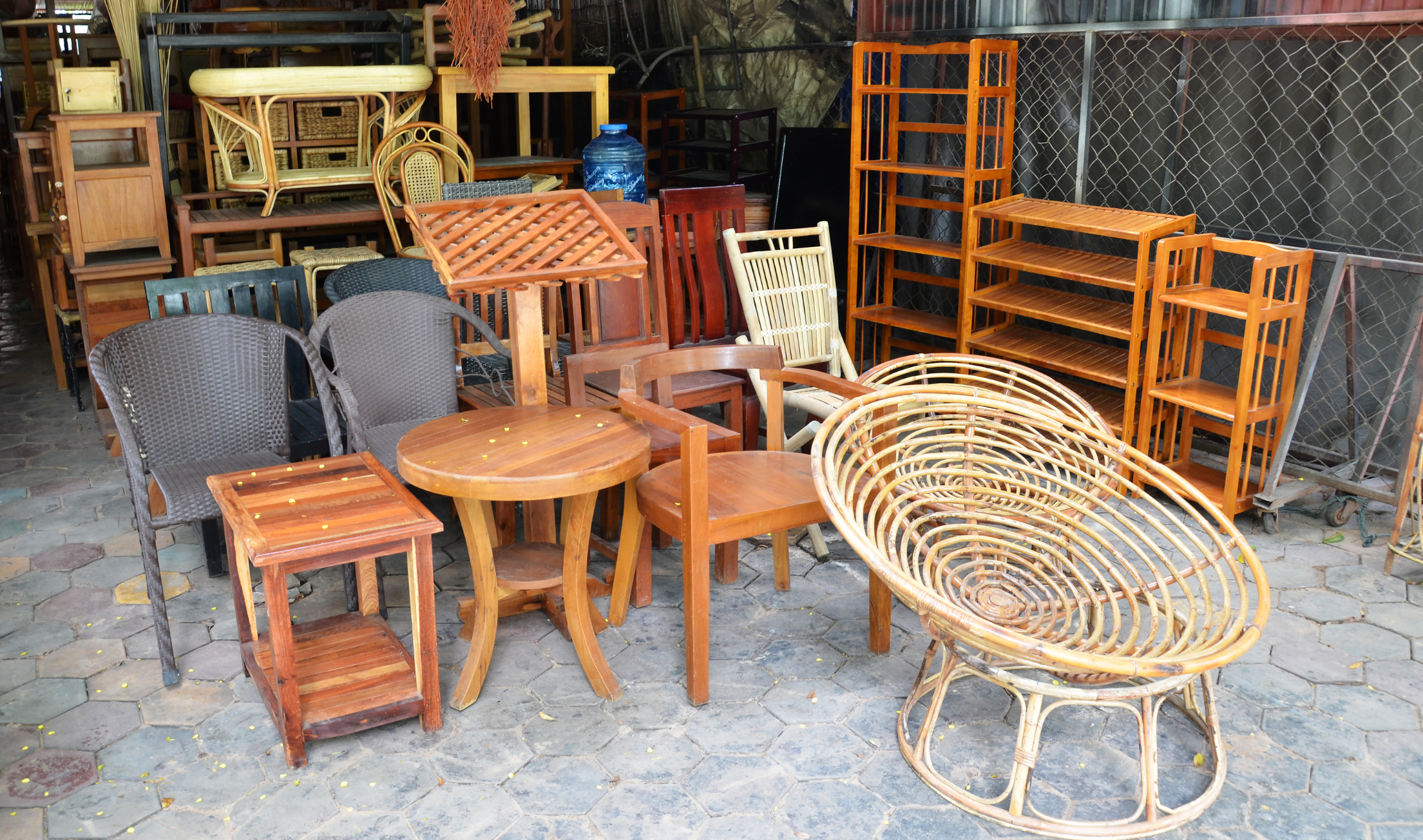 A collection of wood (and other material) furniture in a garage.