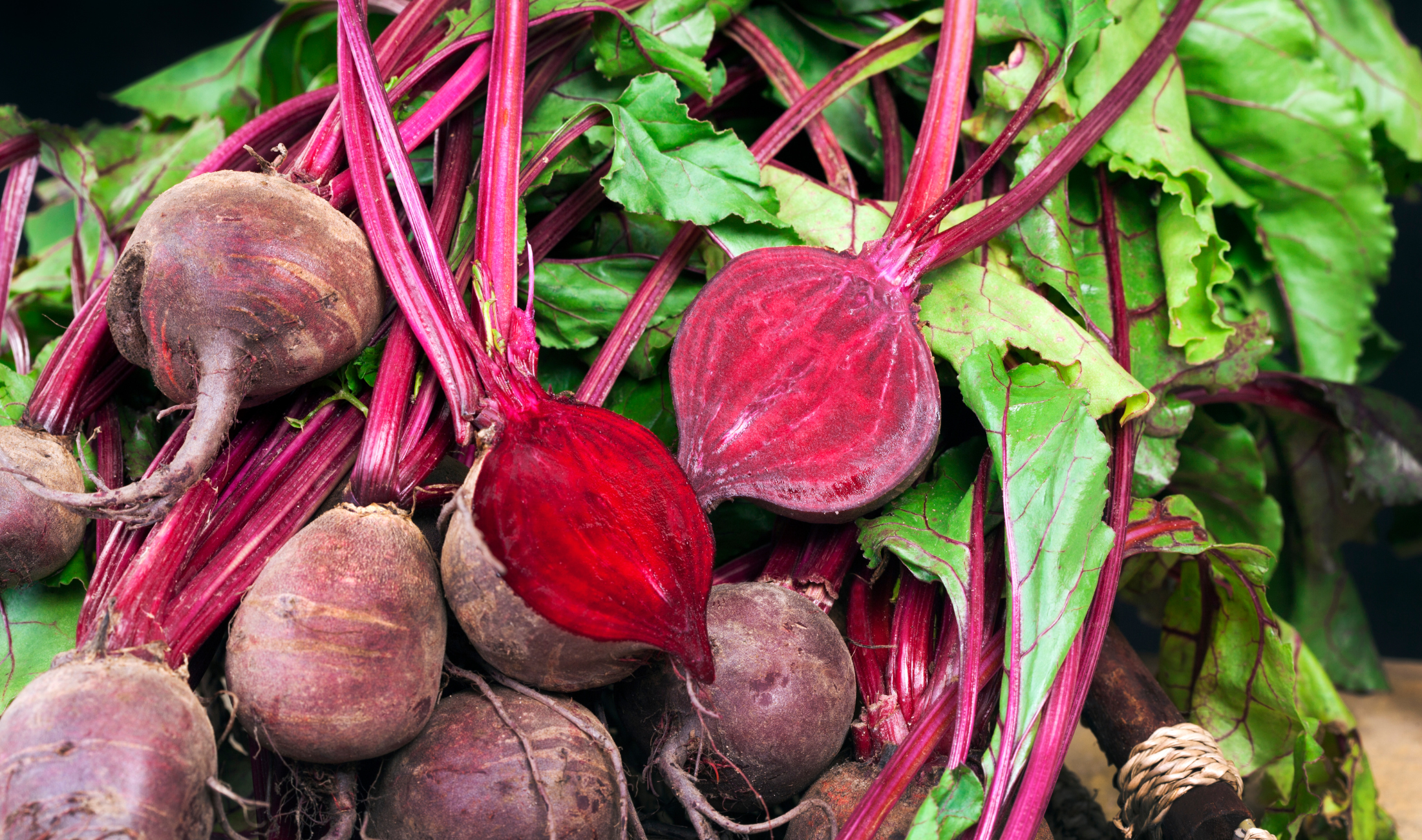 A bunch of radishes, one cut in half.