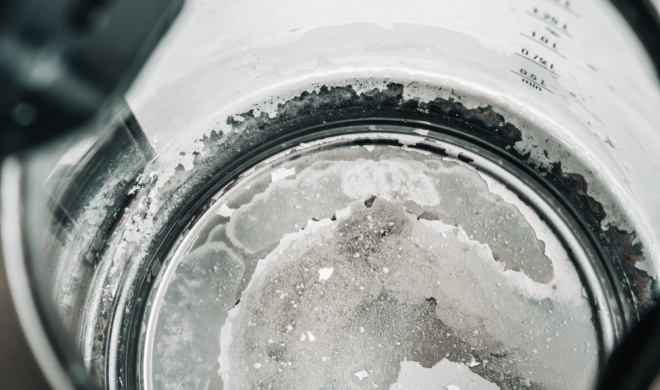 Hard water deposits in an electric kettle.