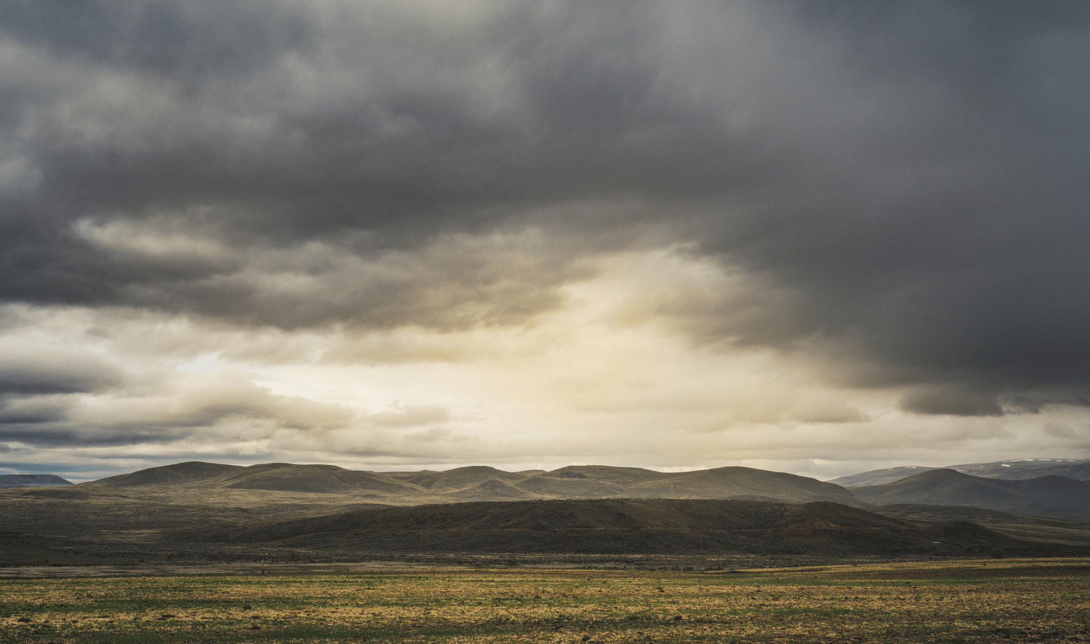 An overcast sky above a plain.
