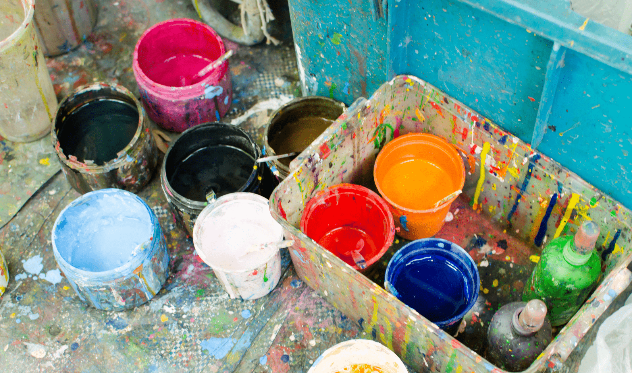 A collection of used paint cans.
