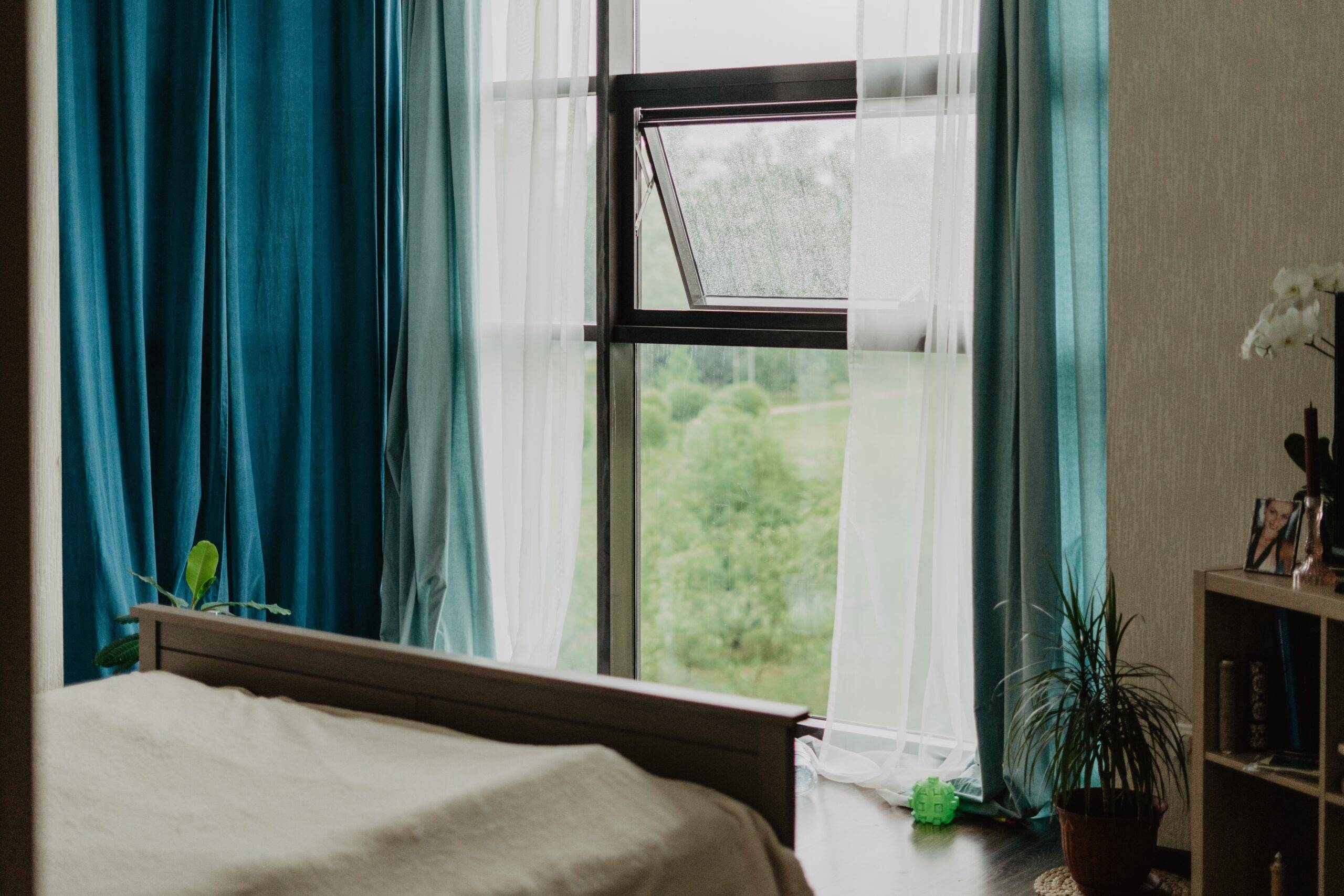 An open window in a bedroom.